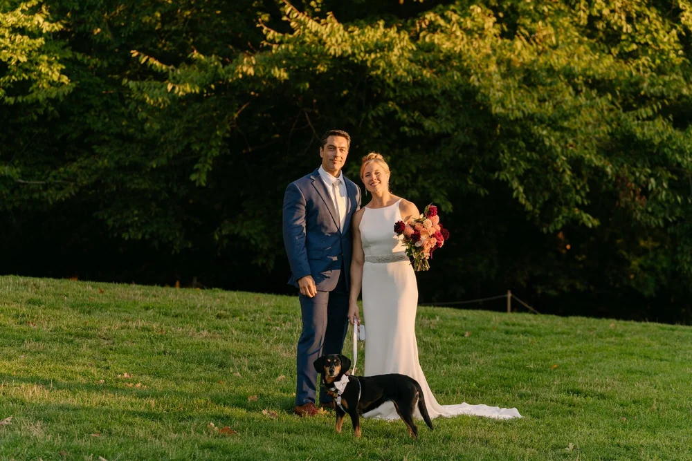 wedding-couple-with-dog-lawn.jpg