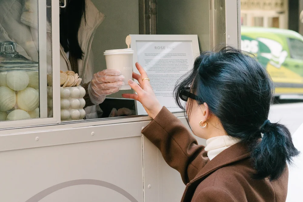rose-inc-food-truck-guest-reaching-drink.jpg