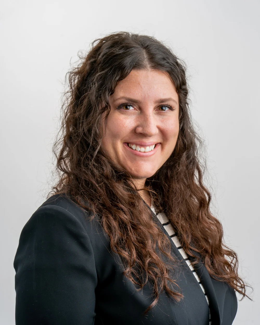 fran-zumbo-headshot-curly-hair-black-blazer-corporate-headshots-nyc.jpg