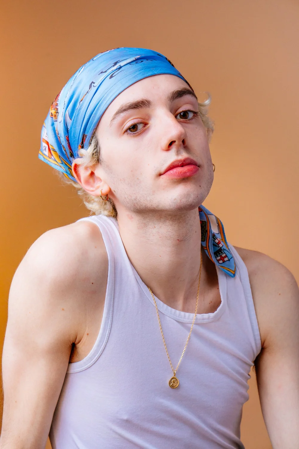 pierre-barbier-portrait-blue-bandana-peach-backdrop.jpg