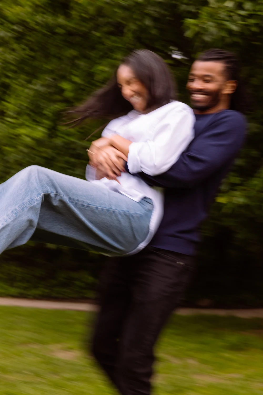 engagement-couple-lift-motion-blur-park.jpg