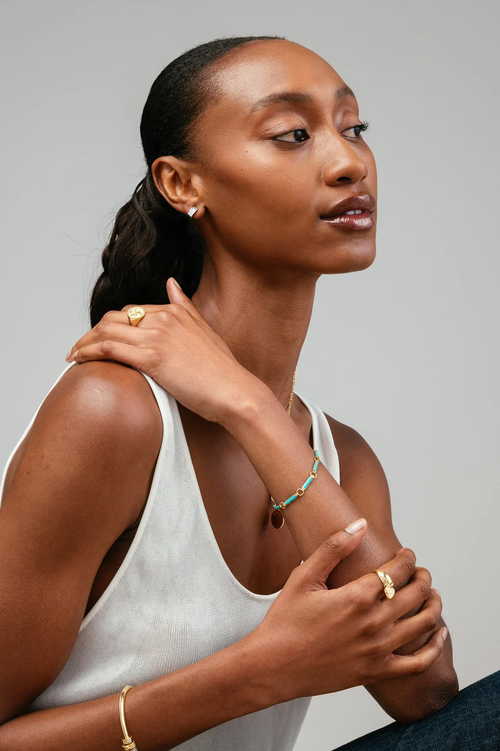 foundrae-model-white-tank-gold-rings-studio-portrait.jpg