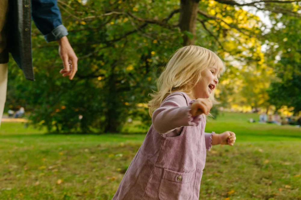 toddler-running-grass-park.jpg