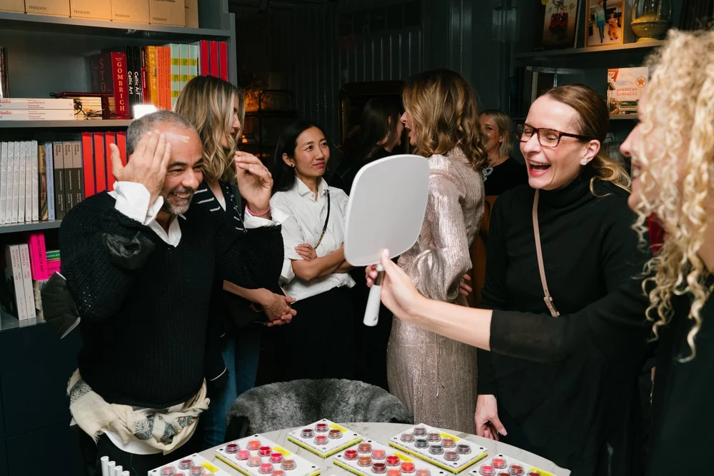 Guests laughing together around the table at the Trinny London VIP dinner