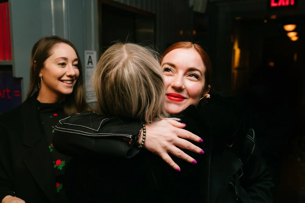 trinny-london-vip-dinner-guests-embracing.jpg