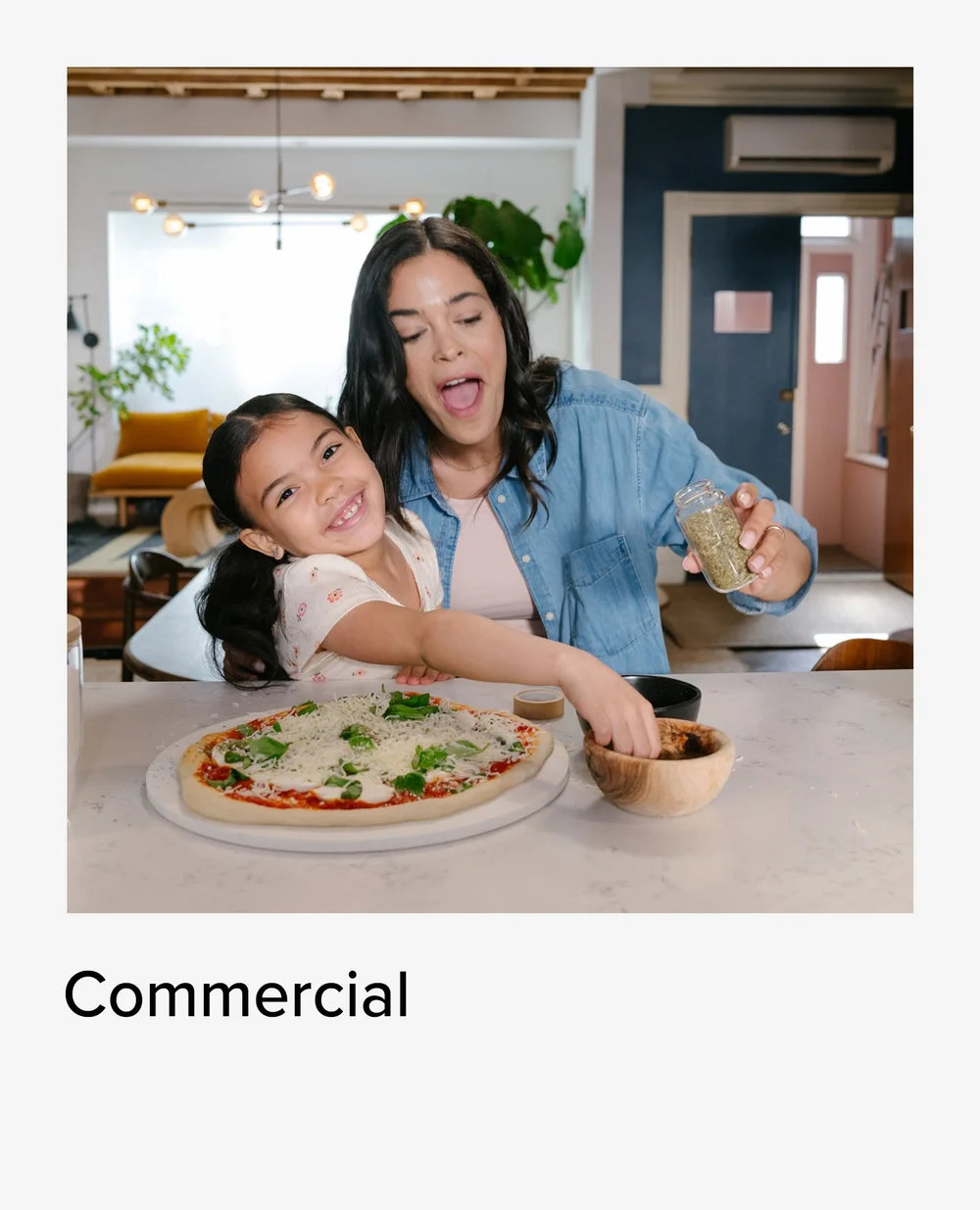 Mother and daughter making pizza at the kitchen table, commercial photographer NYC