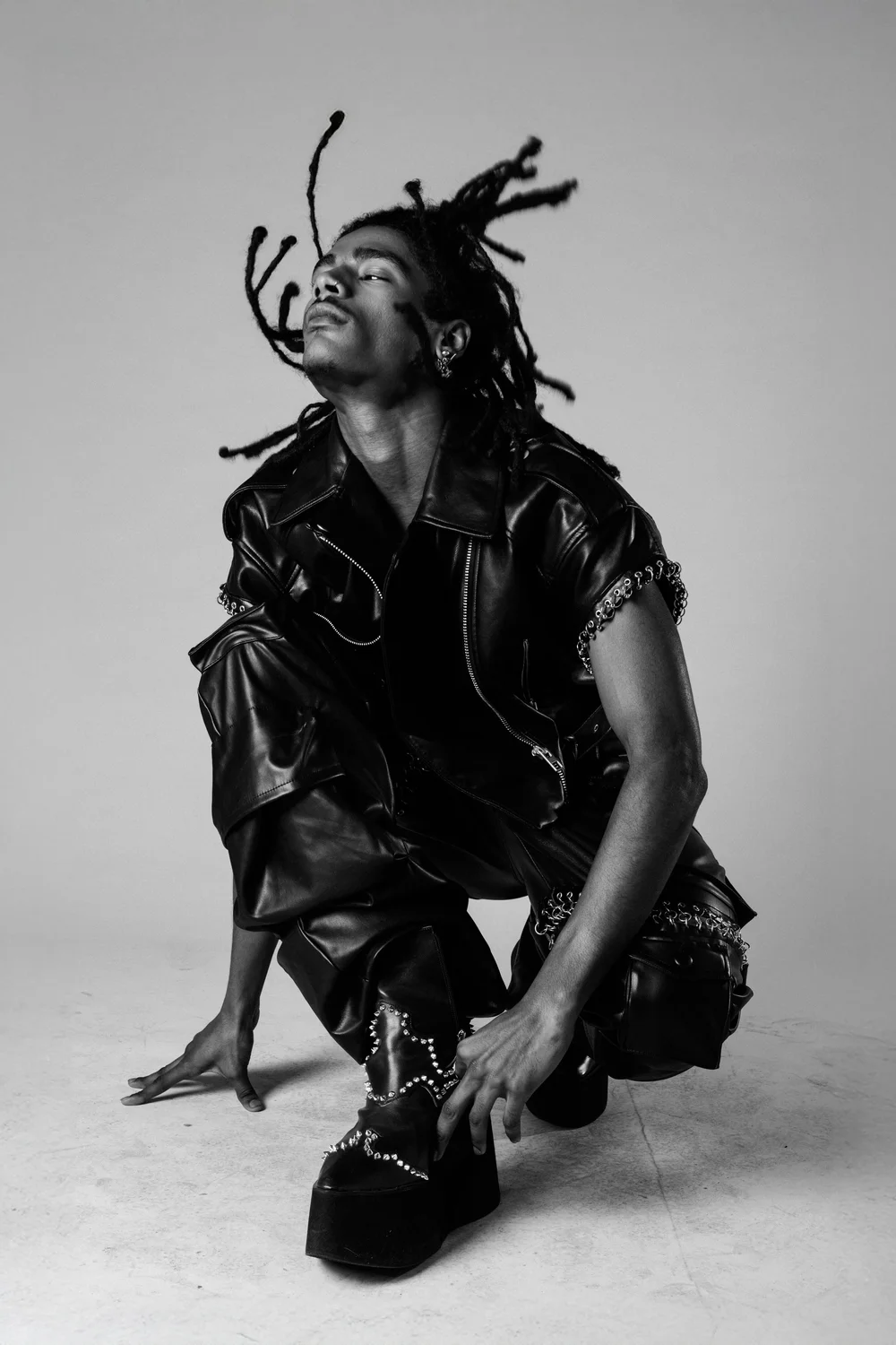 jewelry-leather-designer-model-crouching-black-and-white-fashion-nyc.jpg