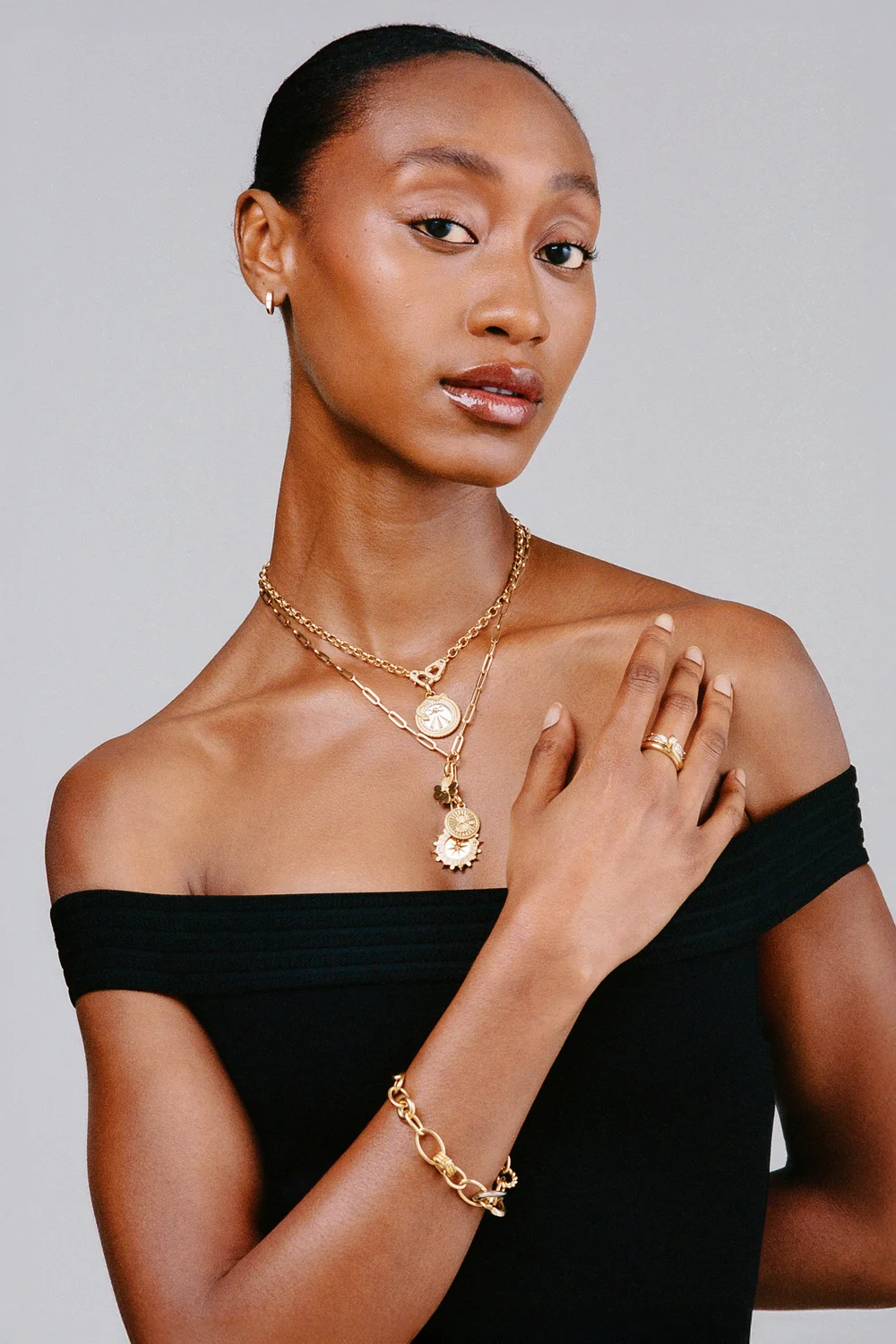 jewelry-photography-model-gold-coin-necklaces-studio.jpg