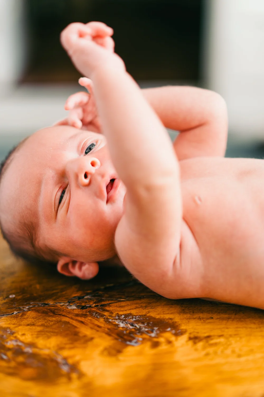 newborn-stretching-warm-light.jpg