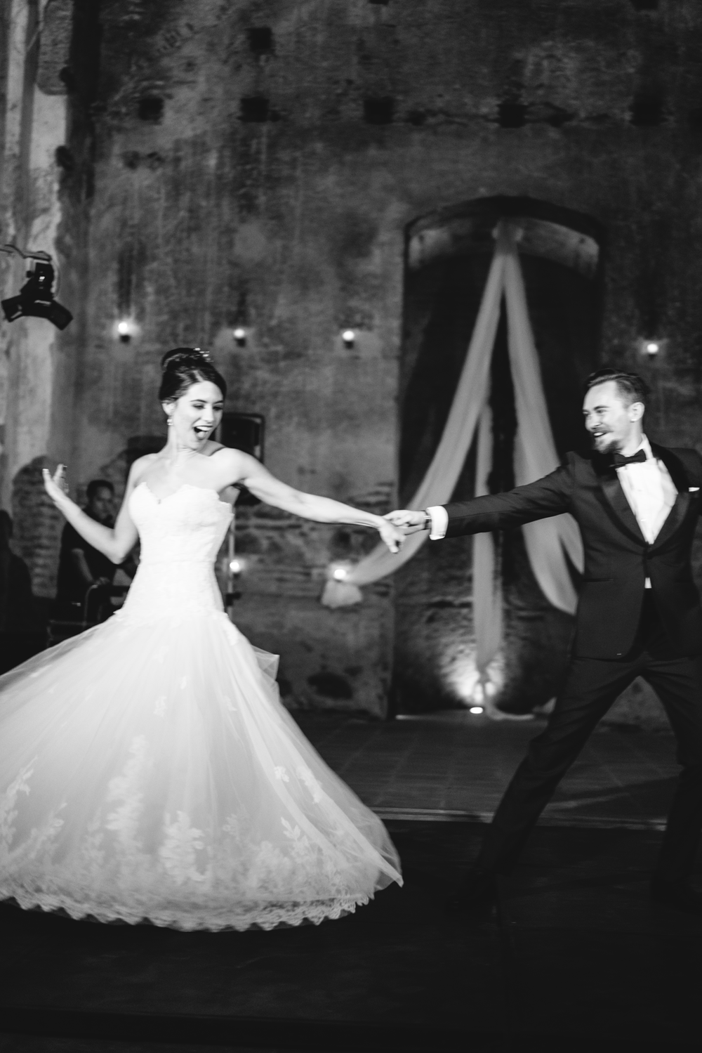 first-dance-arms-outstretched-black-and-white.png