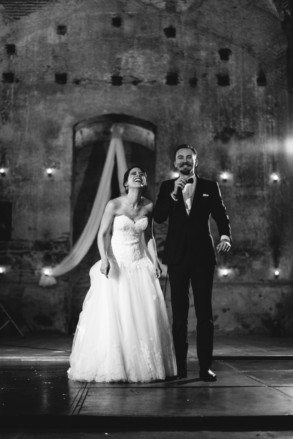 bride-groom-laughing-reception-entrance.png