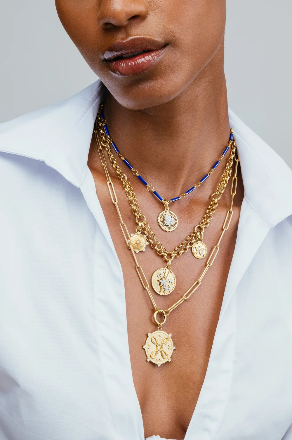 foundrae-layered-gold-medallion-necklaces-white-shirt.jpg