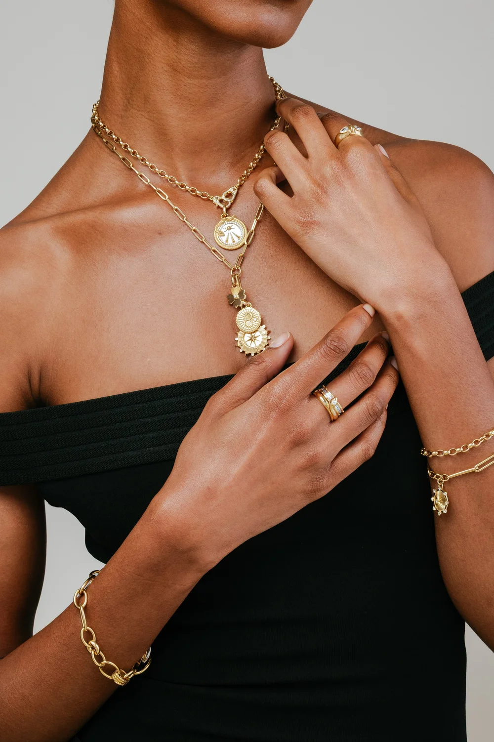 foundrae-gold-necklaces-rings-model-black-top.jpg