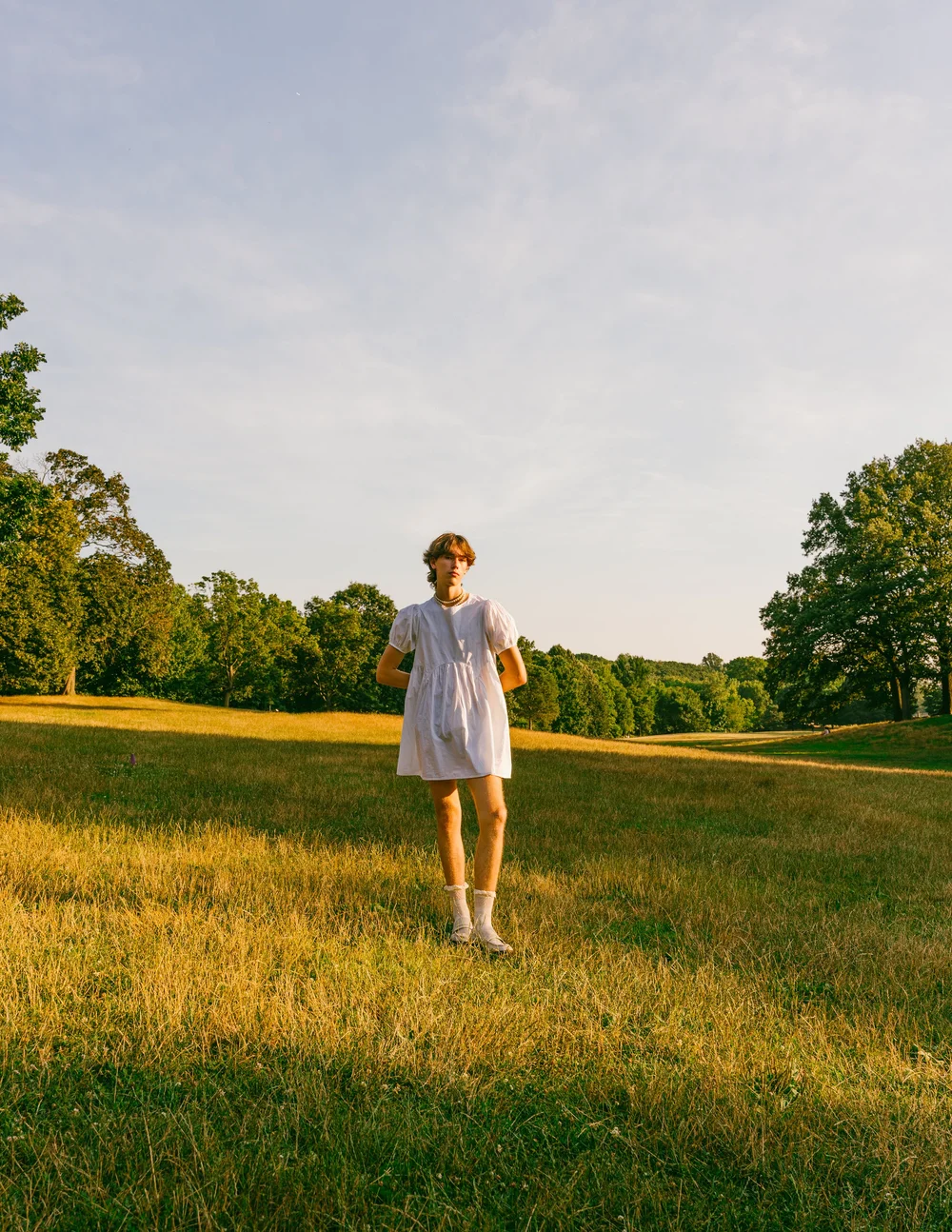 luke-man-white-shirt-meadow-golden-hour-portrait.jpg
