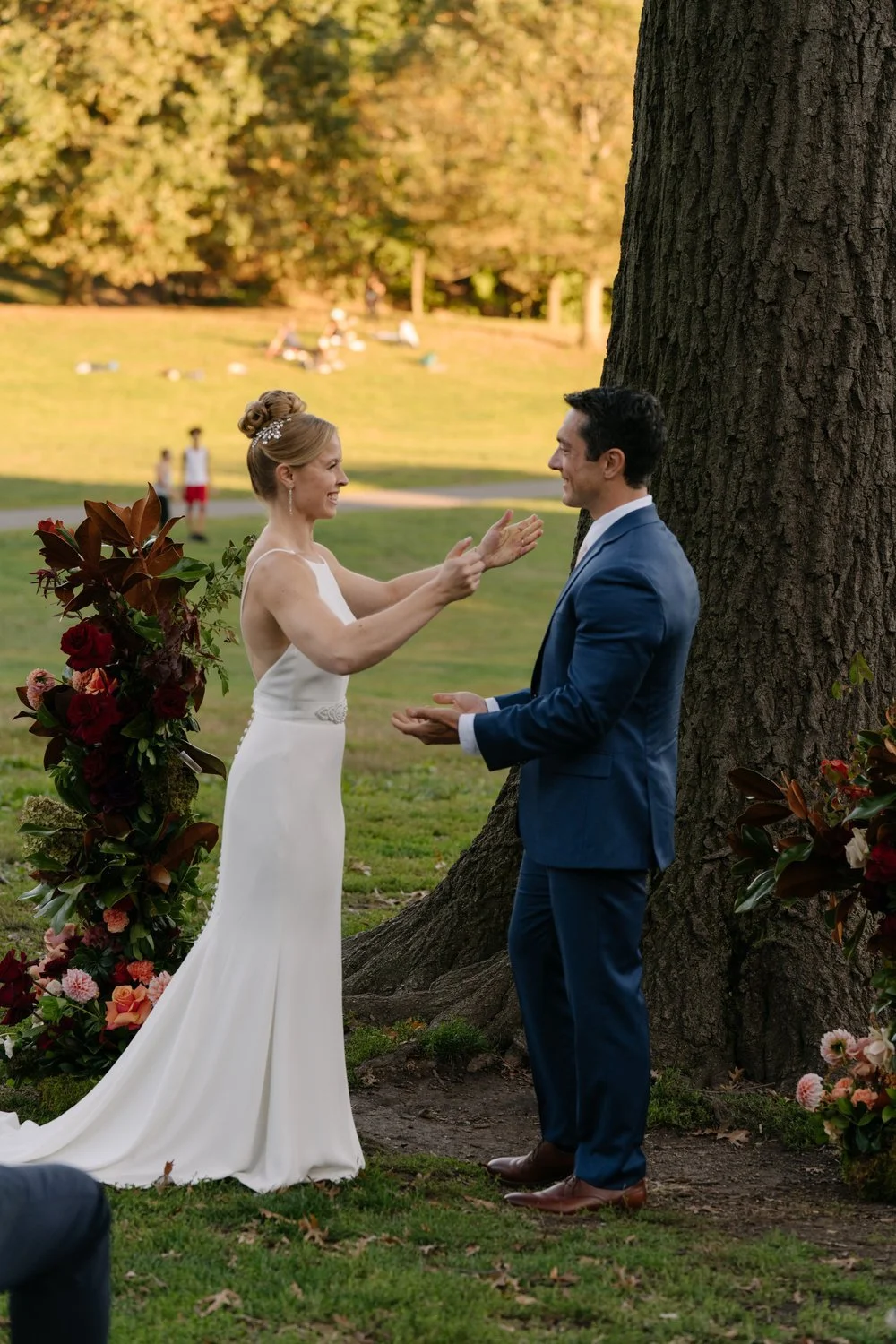 outdoor-wedding-ceremony-couple-big-tree-flowers.jpg