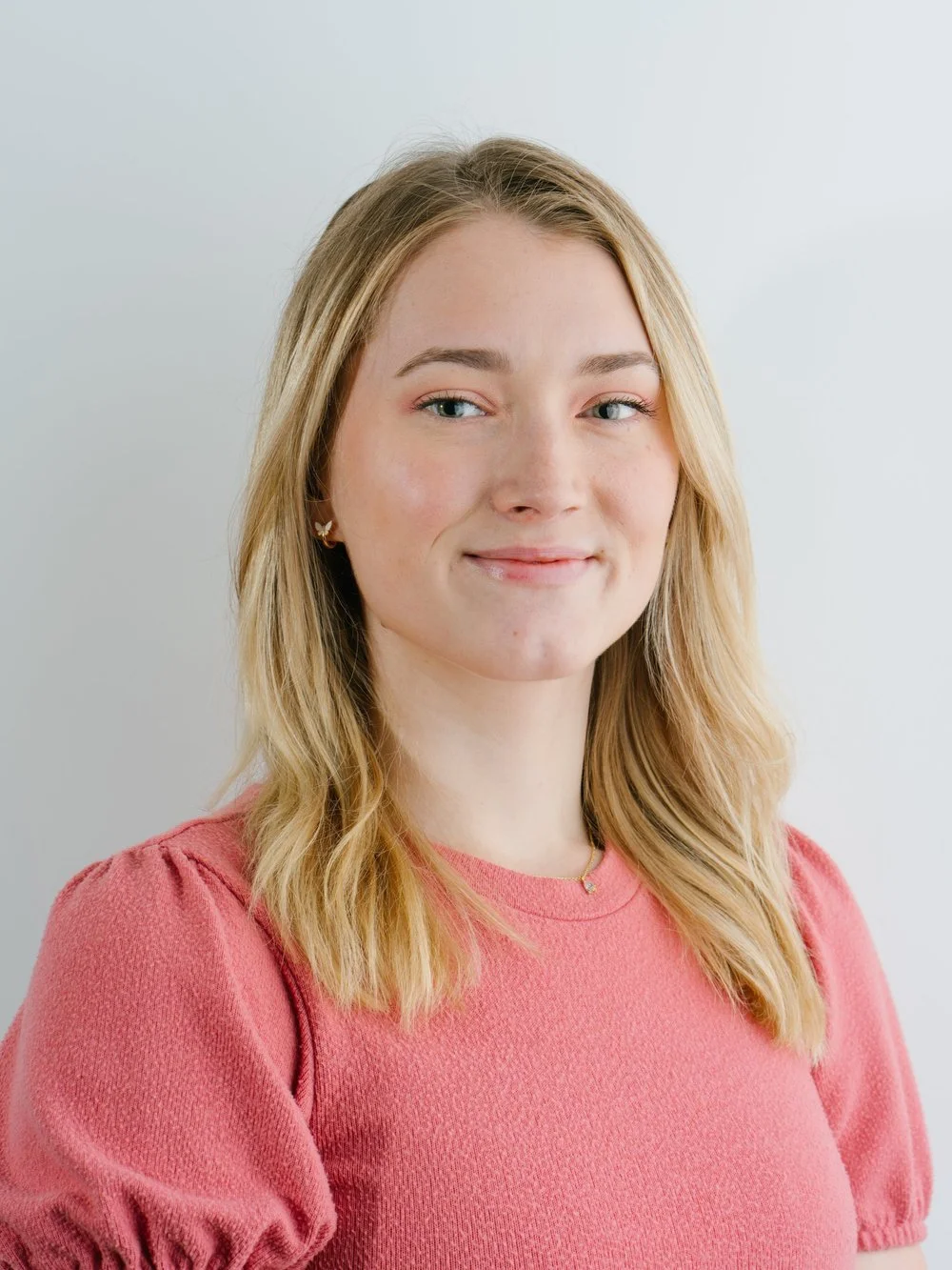 professional-headshot-woman-blonde-pink-sweater-linkedin-headshot-nyc.jpg