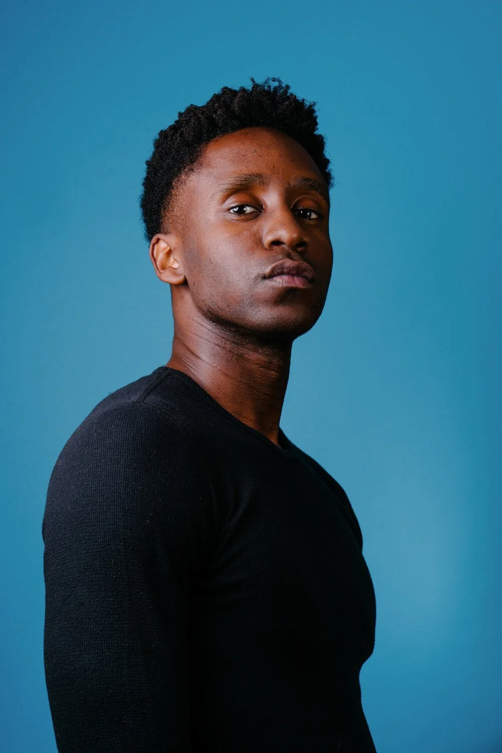shawn-herbert-felton-portrait-blue-backdrop-headshot-nyc-2.jpg