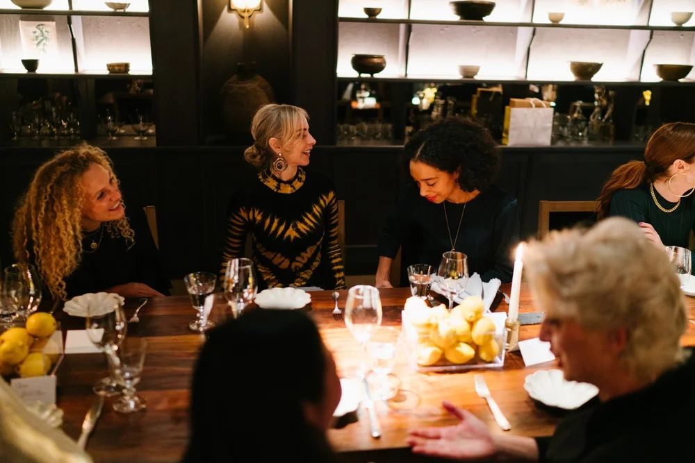 trinny-london-vip-dinner-guests-seated-candlelight.jpg